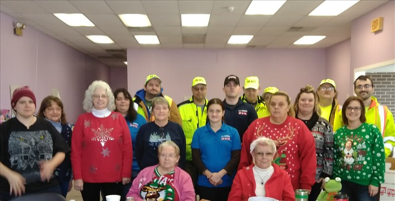 Santa's Elves for the Toys for Tots distribution on December 19th included: Front Row (L to R) Melva McGranor and Carol Knarr, Second Row (L to R): Maria Dixon, Linda Jewell, Jean Williams, KC Reinard, and Pokey Wolfe, Third Row (L to R): Sandy McGuire, Ginger Fox, Sgt. Compton, Samantha Schrecengost, and Ashley Shumaker,  Back Row: Punxsutawney REACT members.
