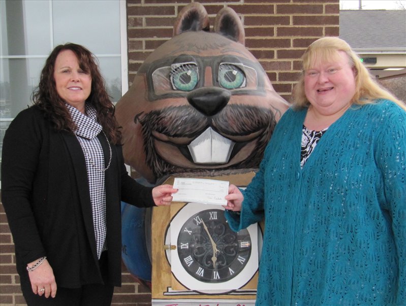 (Pictured l to r:) First Commonwealth Bank's Punxsutawney Branch Manager, Dawn Martin, presented checks to Susan K. Fusco, Executive Director of Community Action, Inc. for $3,985 in community donations received and a matching $5,000 gift from FCBank from their recent Share the Warmth Campaign.