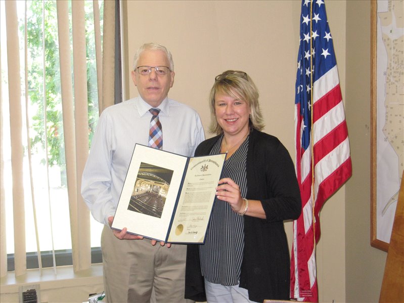Robert A. Cardamone receives a PA House of Representatives Citation for exemplary service from Tina Gibbs, District Constituent Outreach Specialist for Representative Donna Oberlander. 