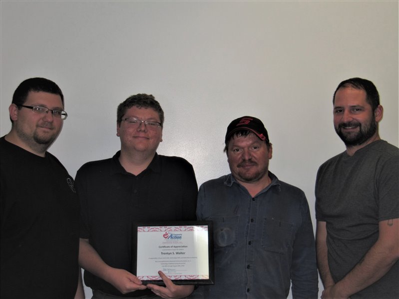 Trentyn Walter, Information Technology Intern, accepted a Certificate of Appreciation from Community Action, Inc.’s Christopher Maze, Technology Support Specialist following his successful completion of his internship..Looking on was Trentyn’s father, Sam Walter and co-supervisor, Thomas Griffith, COPOS Project Manager / Web Developer. (l to r:  Thomas Griffith, Trentyn, Sam Walter, and Christopher Maze.)